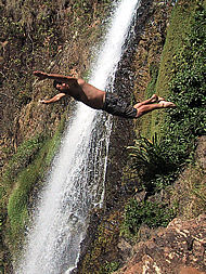 diving into the pool below the El Cora waterfall